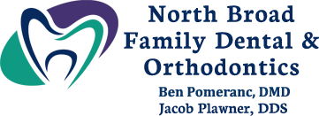 The image shows a logo with text that reads  NORTH BROAD FAMILY DENTAL   ORTHODONTICS  and includes an emblem of a smiley face. The logo is designed to represent a dental practice, suggesting services related to family dentistry and orthodontics.