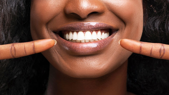A split-screen image of a person smiling, with one side showing the full smile and the other showing a close-up of teeth.