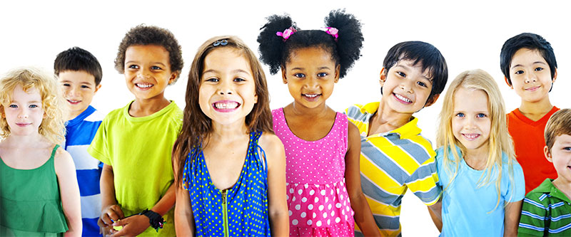 The image shows a diverse group of children and adults posing together, with various expressions and clothing colors.